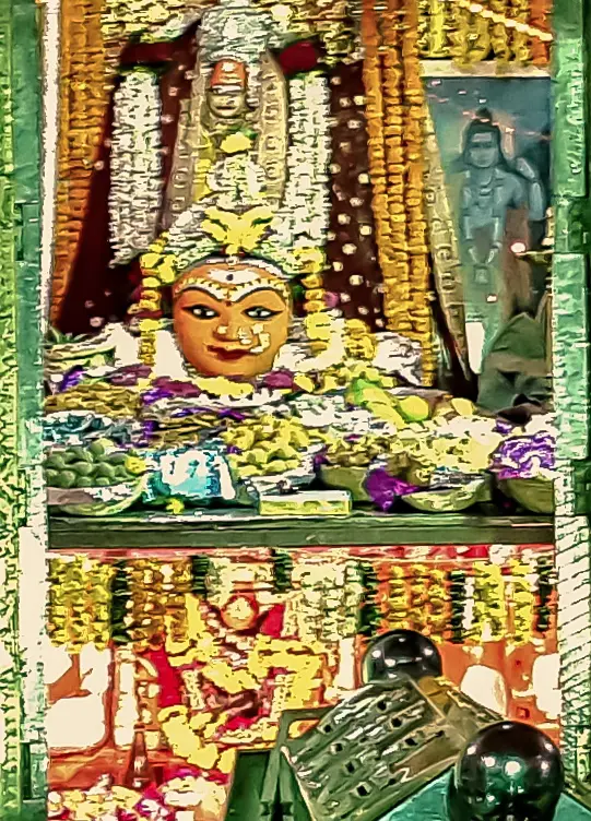 Maa Harsiddhi in the sanctum, adorned for the chhappan bhog (detail cropped from a larger photograph)